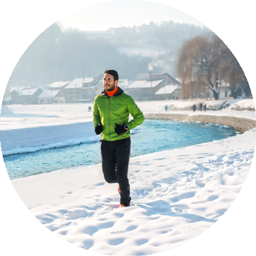 man jogging outside in the snow