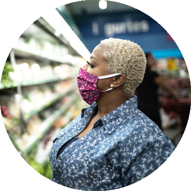 woman in grocery store wearing face mask