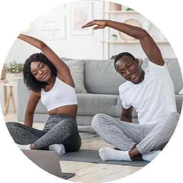 a couple doing yoga during the COVID-19 pandemic.