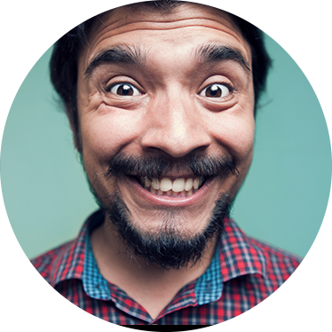 a man widening his eyes to the camera.