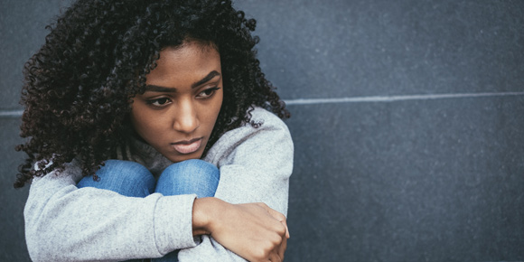 Young girl looking upset