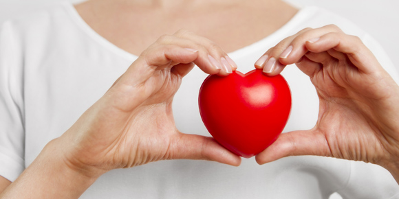 Hands holding a heart shape